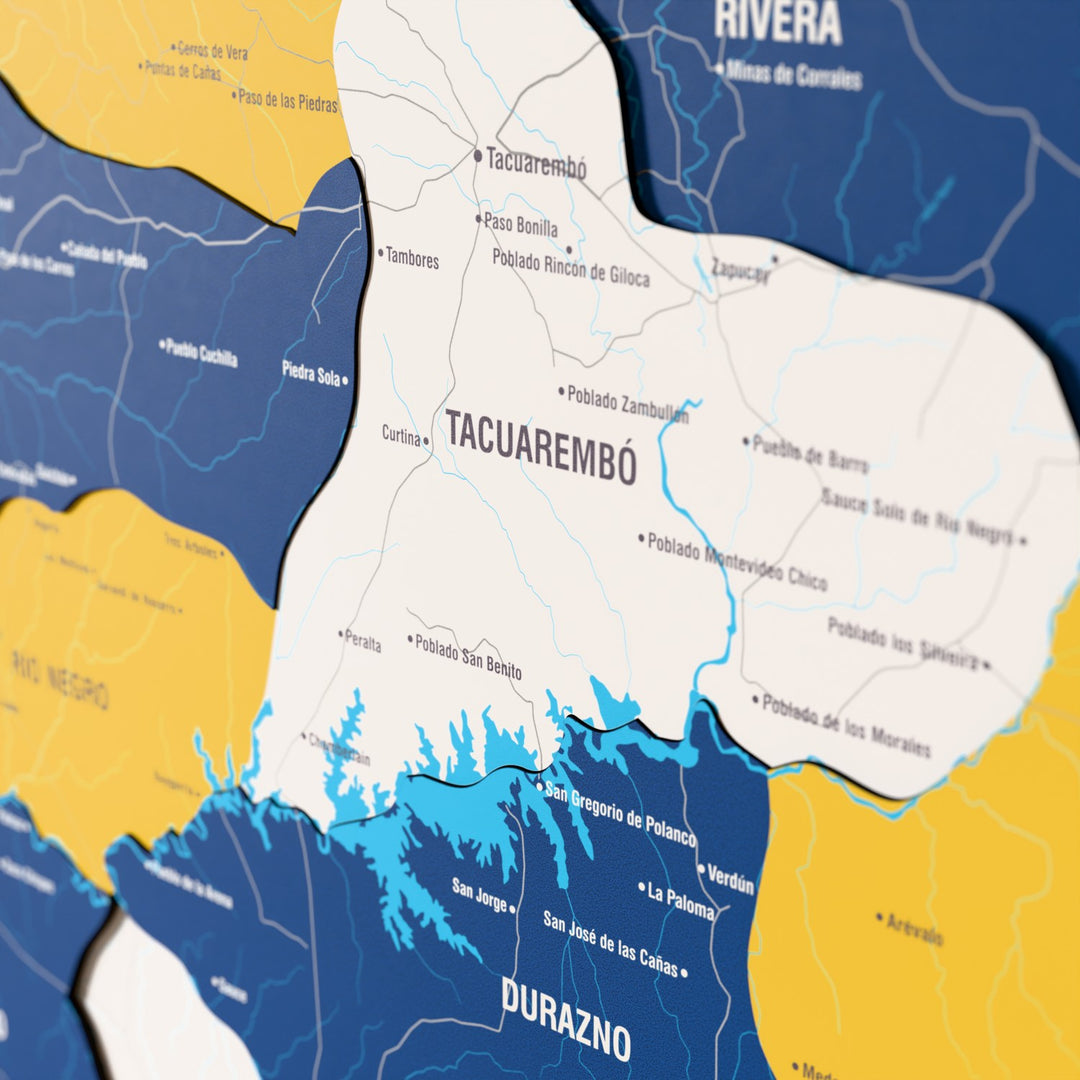 Close-up of the Flag colored Uruguay wooden wall map with layered regions and printed names