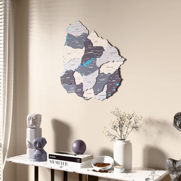 Nimbus Uruguay wooden wall map beside a sheer curtain, angled view