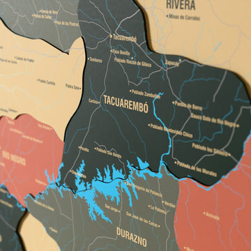 Close-up of the Sage Uruguay wooden wall map with layered regions and printed names