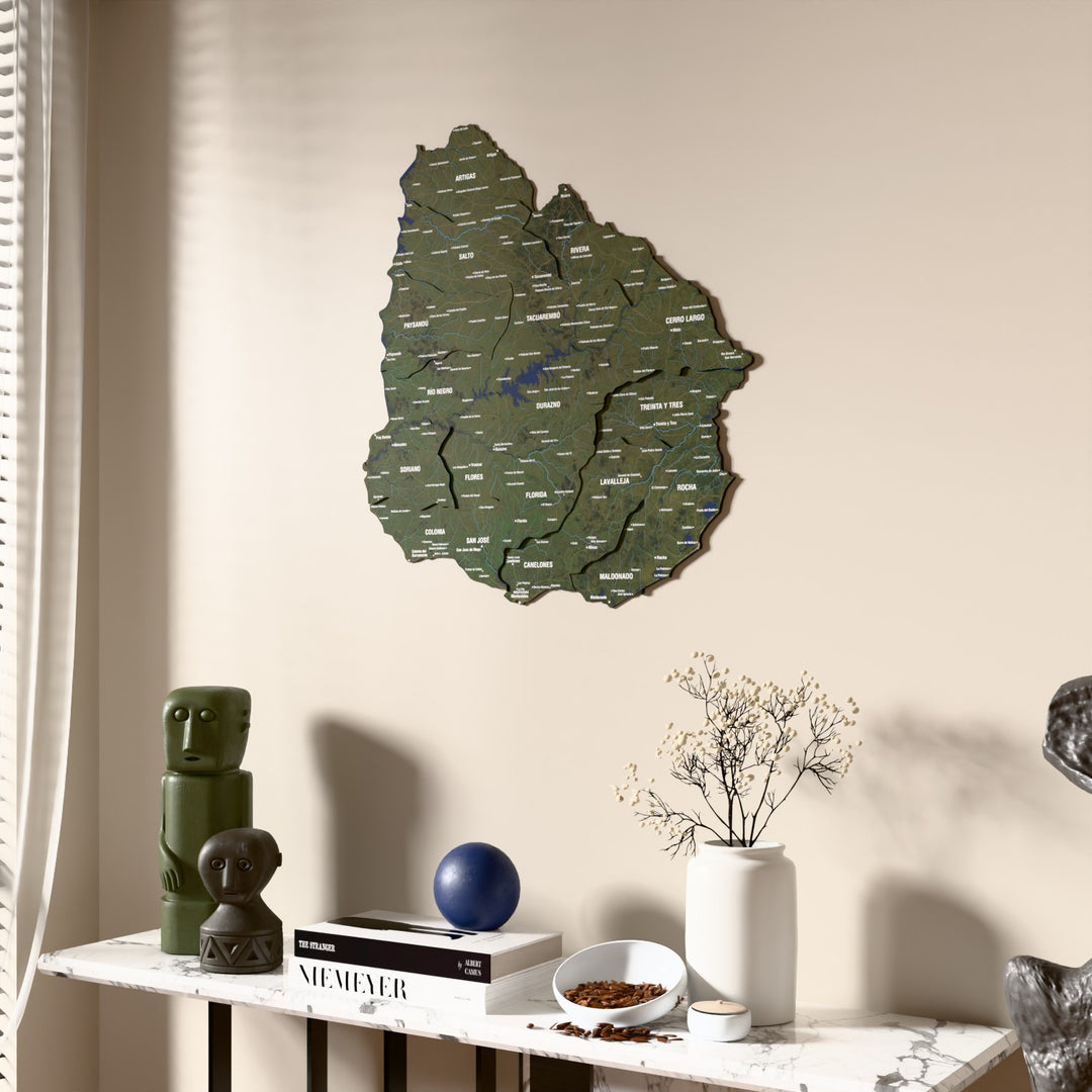 Satellite Uruguay wooden wall map beside a sheer curtain, angled view
