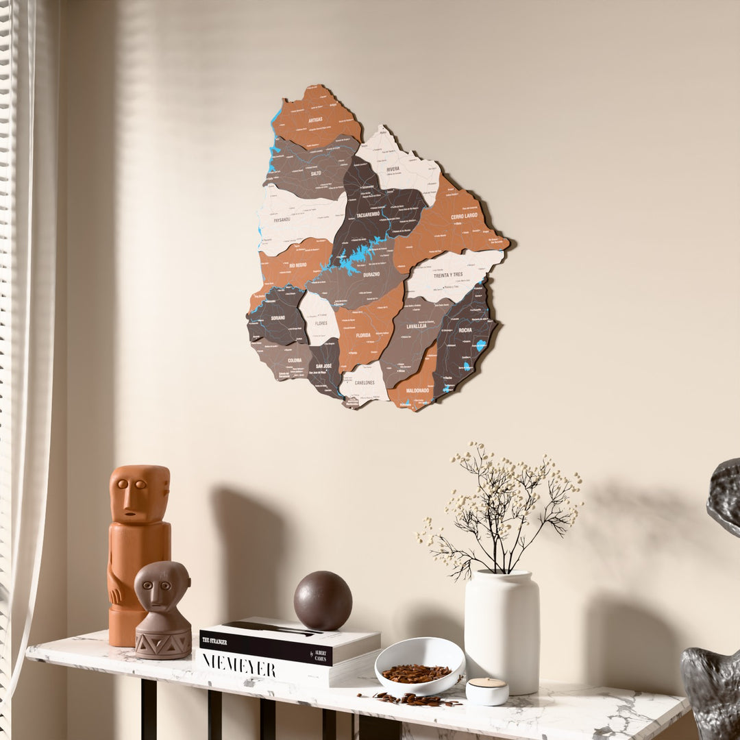 Soil Uruguay wooden wall map beside a sheer curtain, angled view