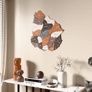 Soil Uruguay wooden wall map beside a sheer curtain, angled view