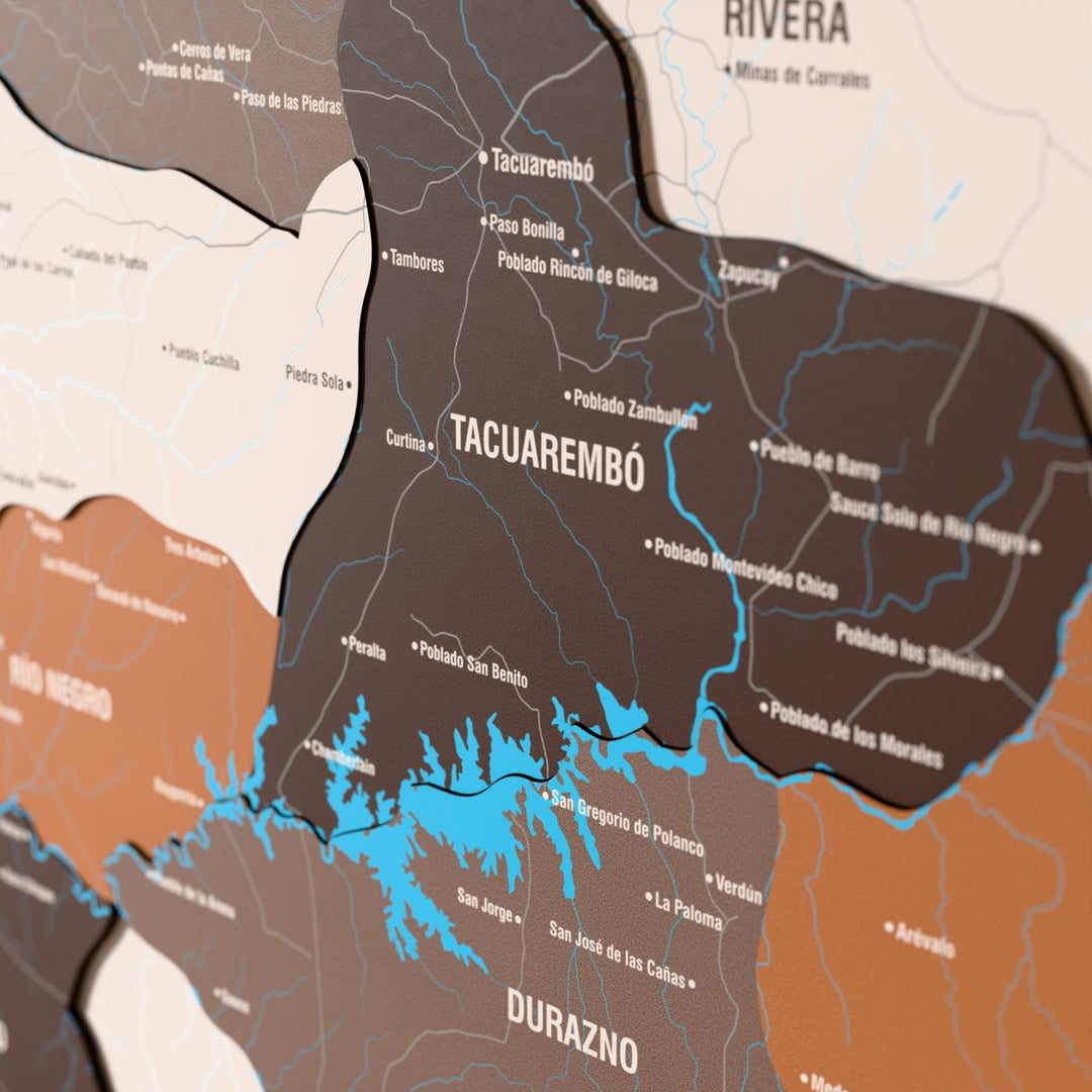 Close-up of the Soil Uruguay wooden wall map with layered regions and printed names
