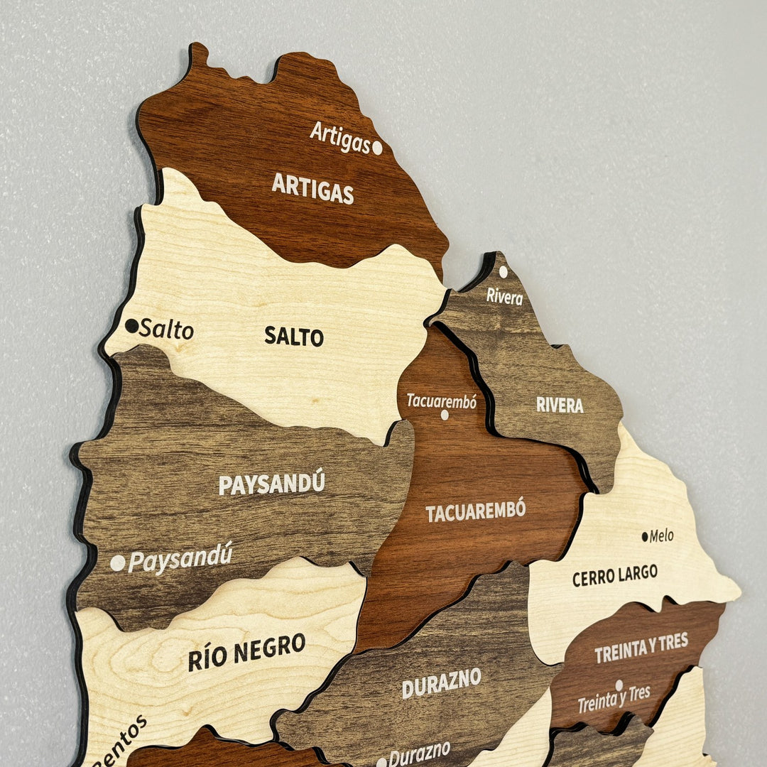 Close-up of Artigas, Salto, Paysandú and Tacuarembó on the layered wooden Uruguay map