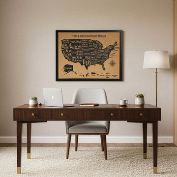 Framed cork USA map with a personalized title, hung above a dark wood desk in a home office