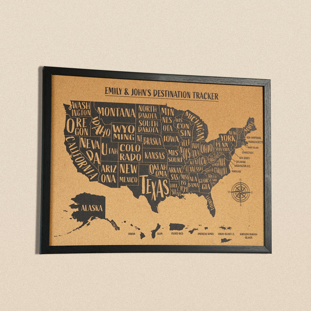 Black-framed cork USA map with Alaska and Hawaii, slightly angled view on a beige background