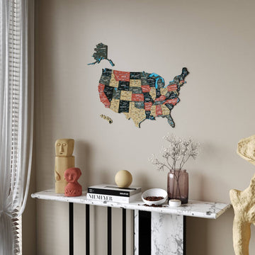 Sage United States wooden wall map beside a sheer curtain, above a marble console with decor