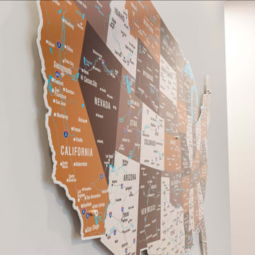Side-angle close-up of California, Nevada and Arizona on the Soil metal USA map with cities and highways