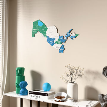 Flag colored Uzbekistan wooden wall map beside a sheer curtain, angled view