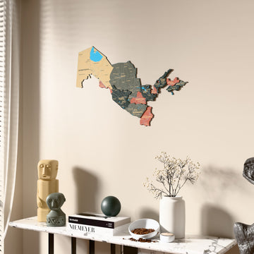 Sage Uzbekistan wooden wall map beside a sheer curtain, angled view