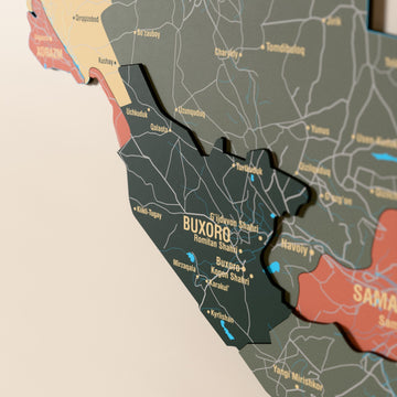 Close-up of the Sage Uzbekistan wooden wall map with layered regions and printed names