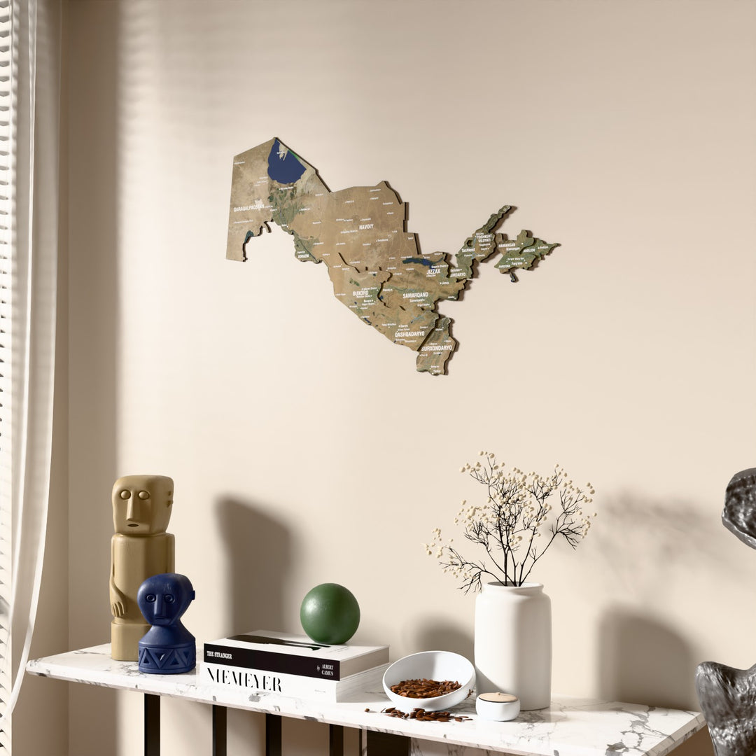 Satellite Uzbekistan wooden wall map beside a sheer curtain, angled view