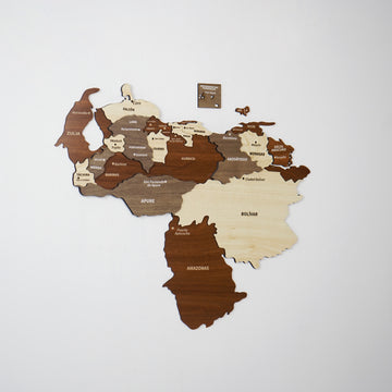 Smaller wooden Venezuela map on a pale gray wall, showing Zulia, Merida and the Amazonas panel in dark brown