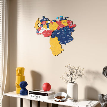 Flag colored Venezuela wooden wall map beside a sheer curtain, angled view