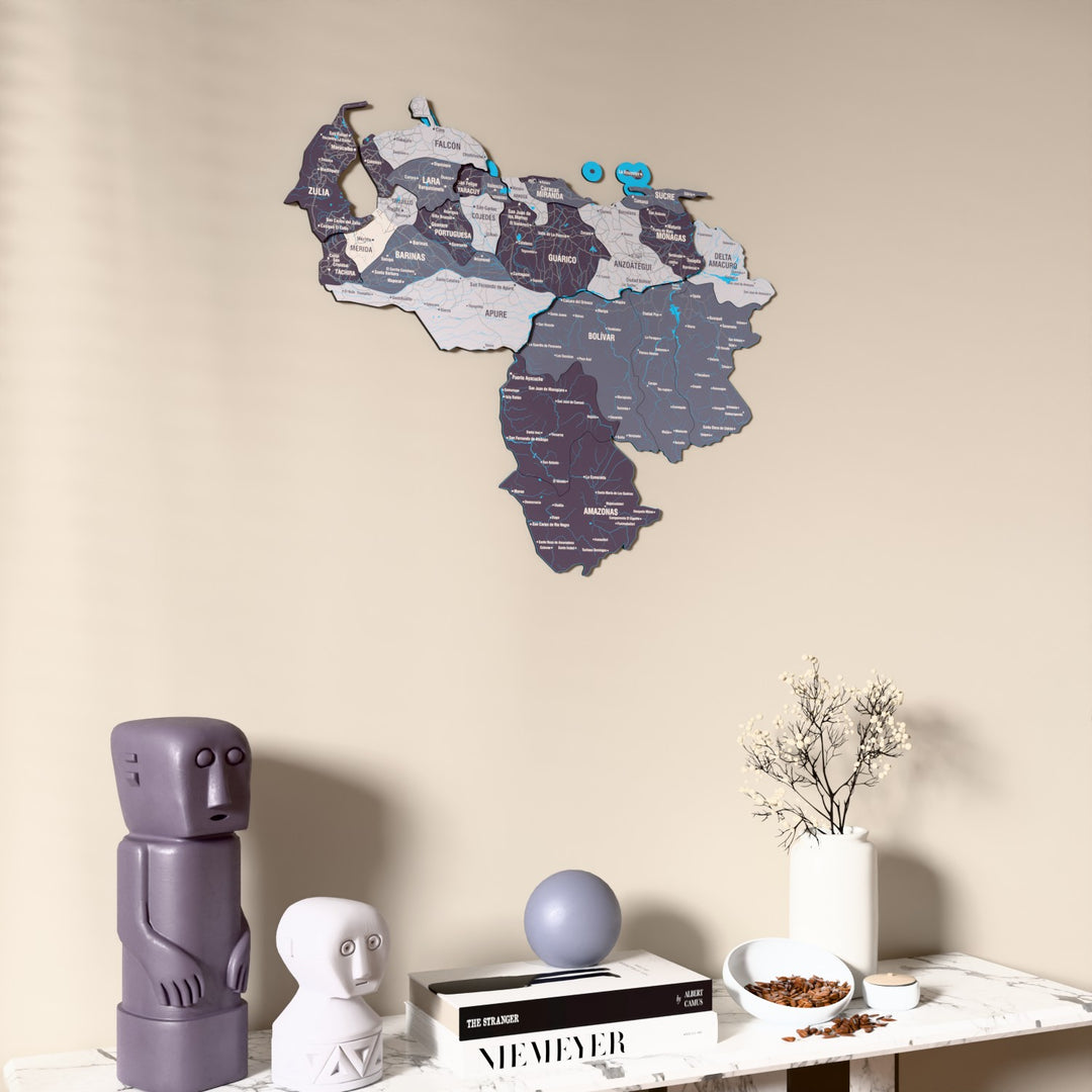 Nimbus Venezuela wooden wall map on a beige wall above a console with figurines