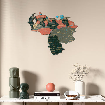Sage Venezuela wooden wall map above a marble console, front view