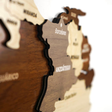 Soft-focus close-up of the wooden Venezuela map showing Anzoategui, Barcelona and Guarico layers