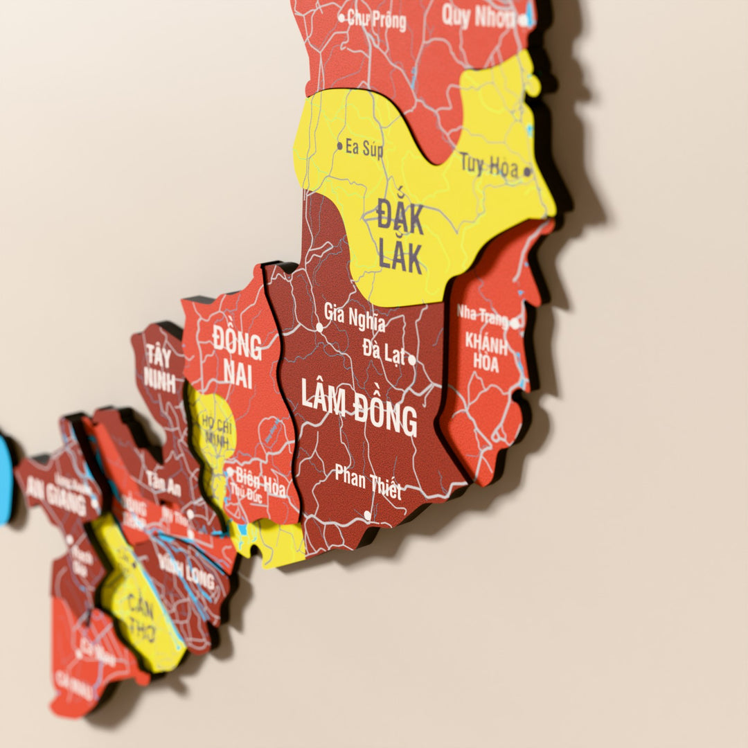 Close-up of the Flag colored Vietnam wooden wall map with layered regions and printed names