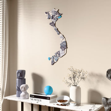 Nimbus Vietnam wooden wall map beside a sheer curtain, angled view