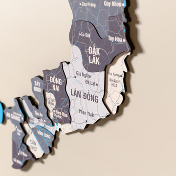 Close-up of the Nimbus Vietnam wooden wall map with layered regions and printed names