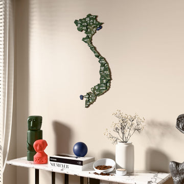 Satellite Vietnam wooden wall map beside a sheer curtain, angled view