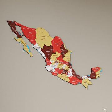 Terra Mexico wooden wall map in red, maroon and mustard states on a beige wall, angled view showing the layered pieces