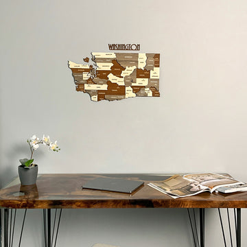 Washington State wooden wall map with WASHINGTON lettering above a resin desk, tight crop