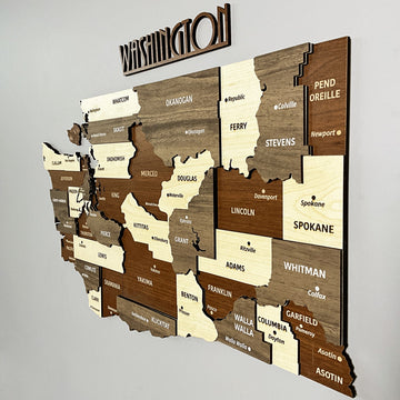 Close-up of the Washington State wooden map showing Spokane, Whitman, Okanogan and Yakima counties in layers