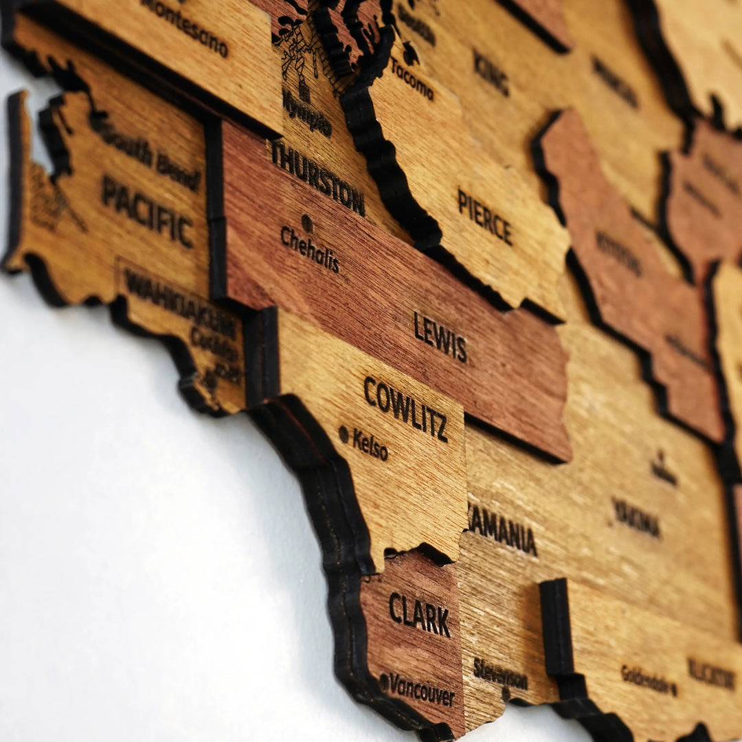 Close-up of layered Washington county pieces for Thurston, Lewis, Cowlitz and Clark with engraved names
