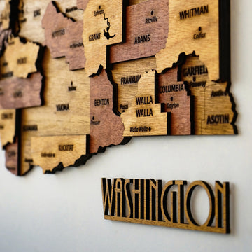 Side-angle close-up of eastern Washington counties and the WASHINGTON cut-out lettering on a white wall
