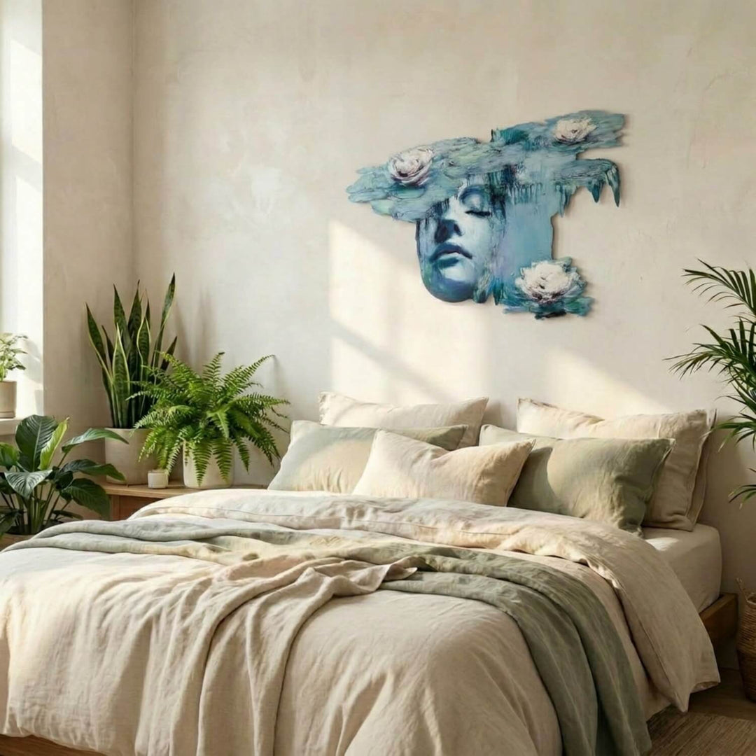 Water lilies and woman metal wall art above a bed in a bright bedroom