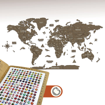 Betul wooden world map with country names and a flag pin sheet at the lower left corner, on a white wall
