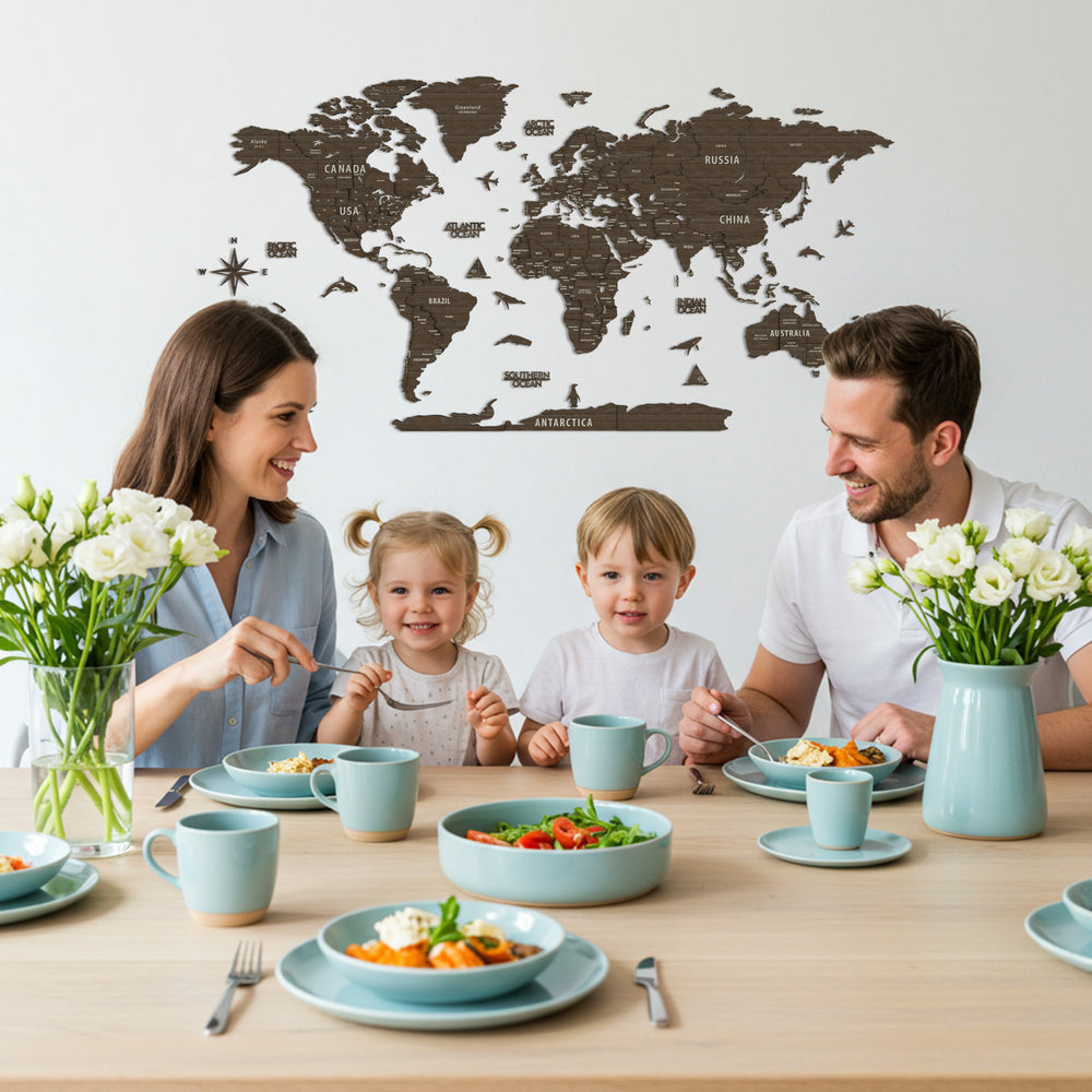 Happy family sitting at a table eating with a world map in the background