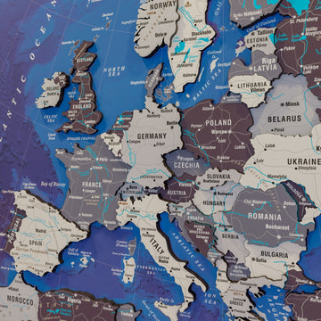 Close-up of Europe on the Nimbus wooden map with Germany, France, Poland and Italy and river lines in teal