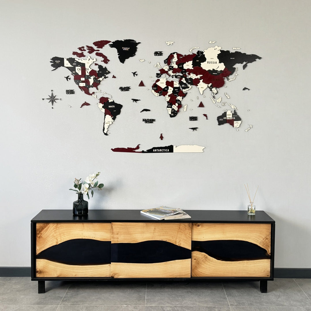 Burgundy wooden world map above a live-edge wood and black resin sideboard, centered wide view
