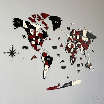 Large burgundy wooden world map with compass rose and North America, South America and Antarctica filling the frame