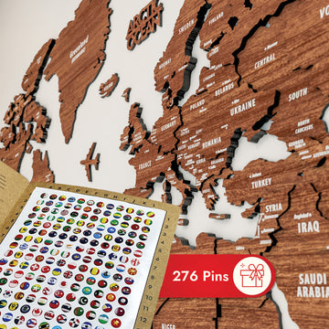 Close-up of Europe and the Middle East on the light brown wooden world map with a card of 276 pins