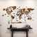 World map wall decoration on a plain wall with a wooden table below.