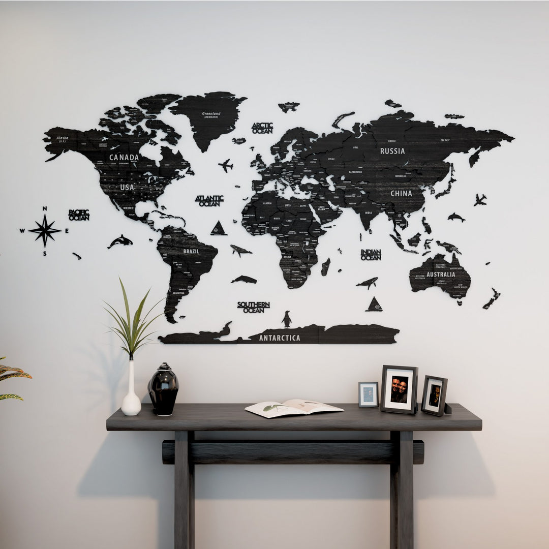 World map wall decal on a light gray wall above a wooden desk.