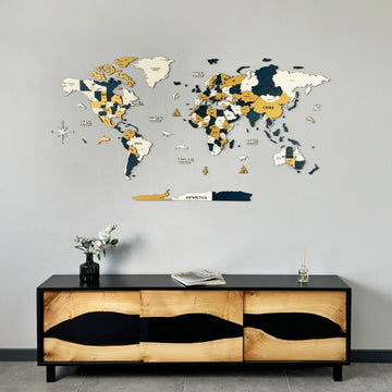 Yellow and navy wooden world map centered above a live-edge wood and black resin sideboard