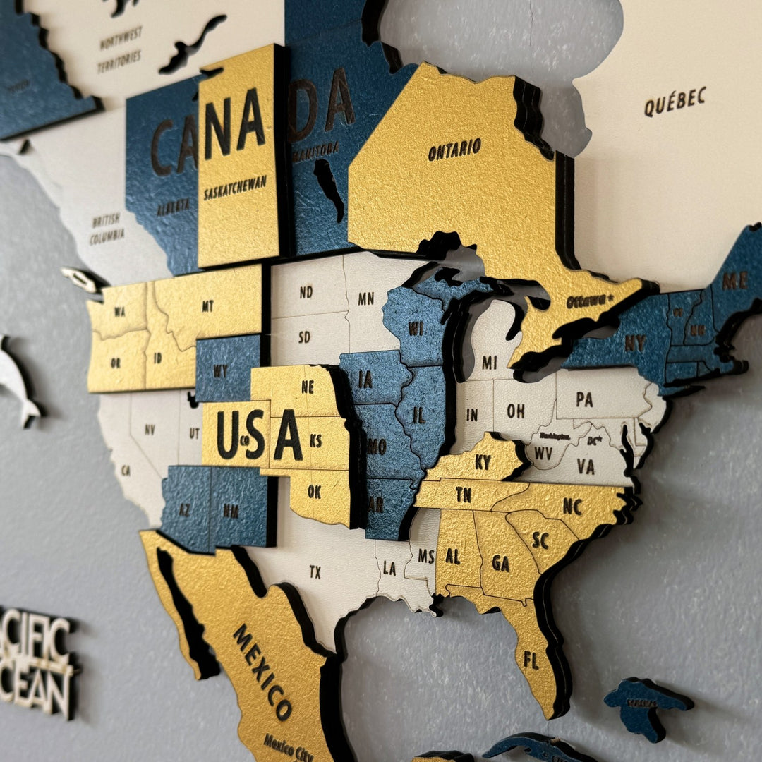 Close-up of North America on the yellow wooden world map showing USA, Canada and Mexico in layered wood