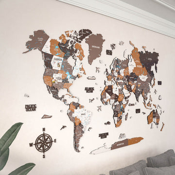 Soil wooden world map with a compass rose, angled view of the Americas