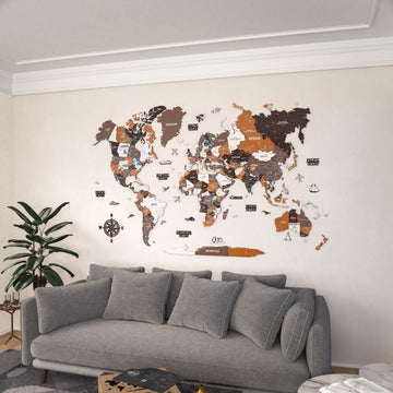 Soil wooden world map above a gray sofa, wide room view