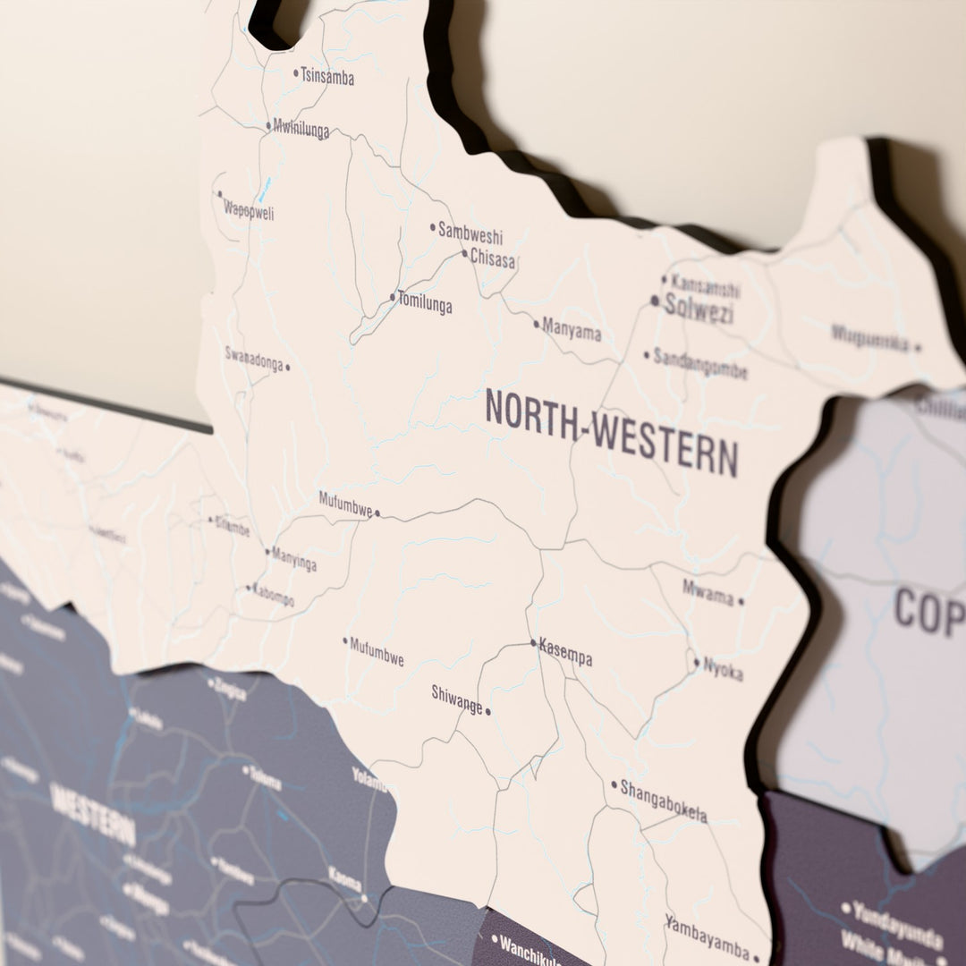 Close-up of the Nimbus Zambia wooden wall map with layered regions and printed names