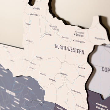 Close-up of the Nimbus Zambia wooden wall map with layered regions and printed names