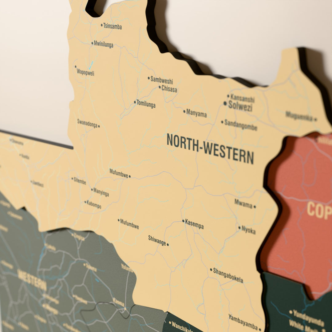 Close-up of the Sage Zambia wooden wall map with layered regions and printed names