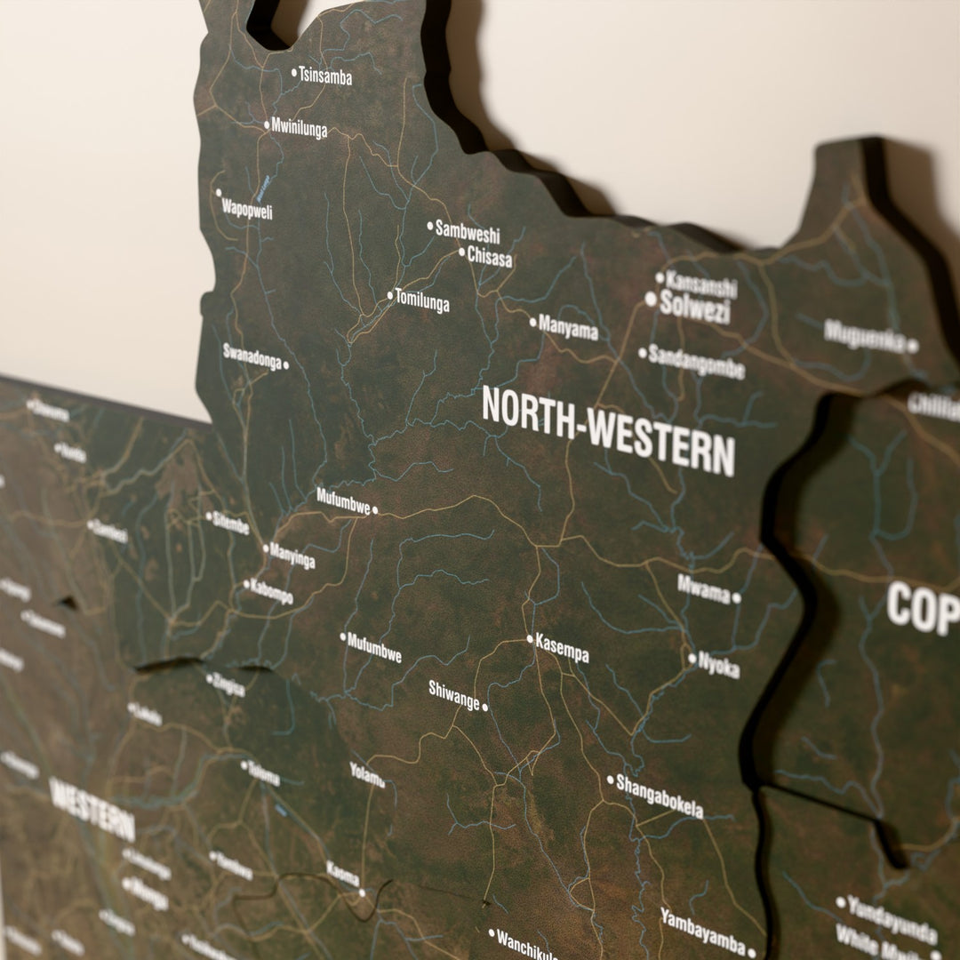 Close-up of the Satellite Zambia wooden wall map with layered regions and printed names