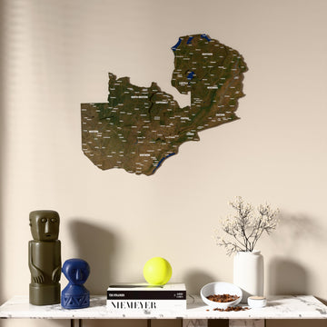 Satellite Zambia wooden wall map above a marble console, front view