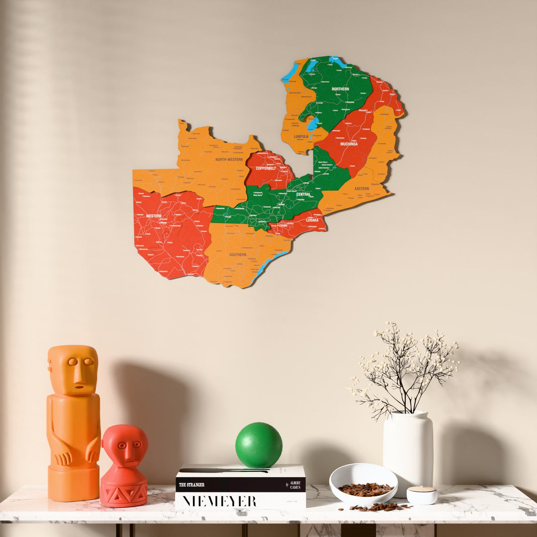 Flag colored Zambia wooden wall map above a marble console, front view