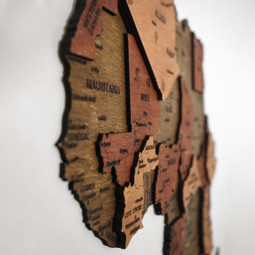 Angled close-up of the wooden Africa map showing stacked country layers around Mauritania, Mali and Ivory Coast